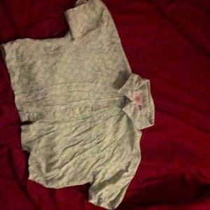 Crop top with daisys print of the shirt it is in good condition